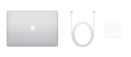A macbook pro is sitting on top of a white table next to a cable and charger.