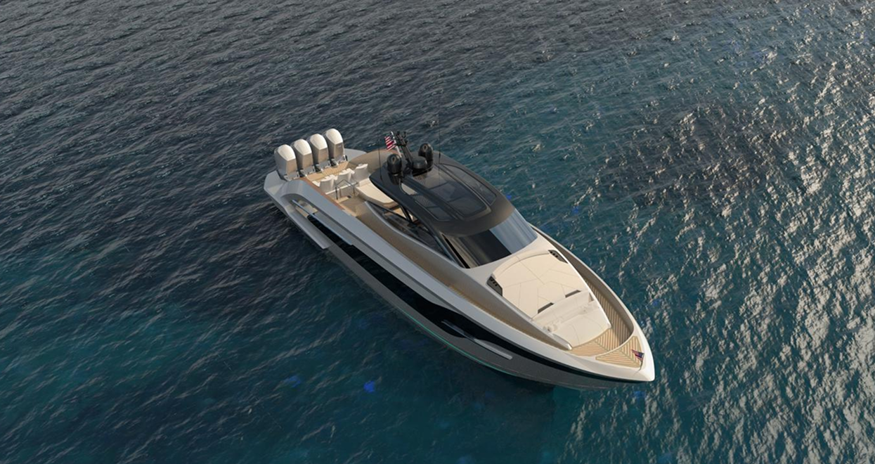 A sleek, modern motor yacht with a black and silver hull, floating on blue water.