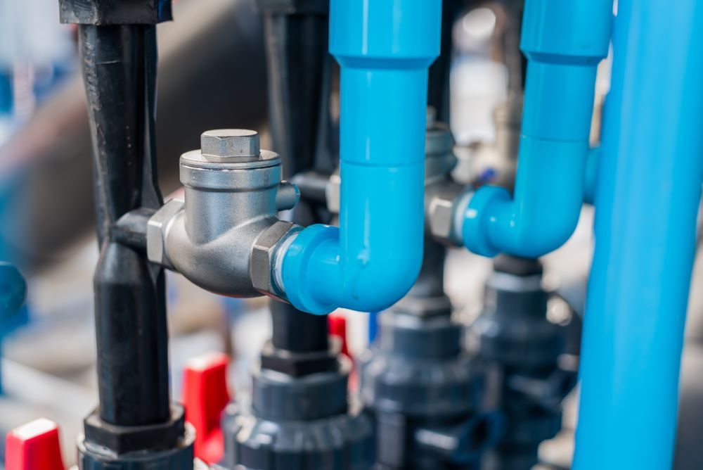 A Close Up of a Bunch of Blue Pipes and Valves — FC Gas Fitting in Maryborough, QLD