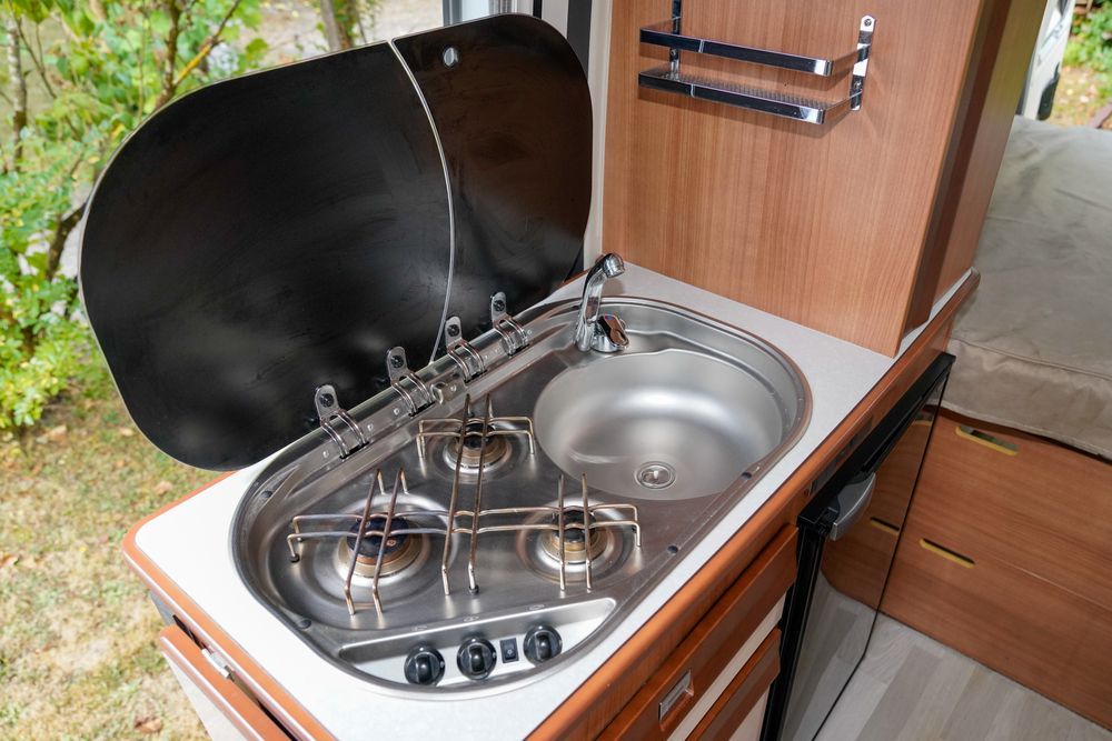 A Bunch of Gas Cylinders With Red Handles — FC Gas Fitting in Maryborough, QLD