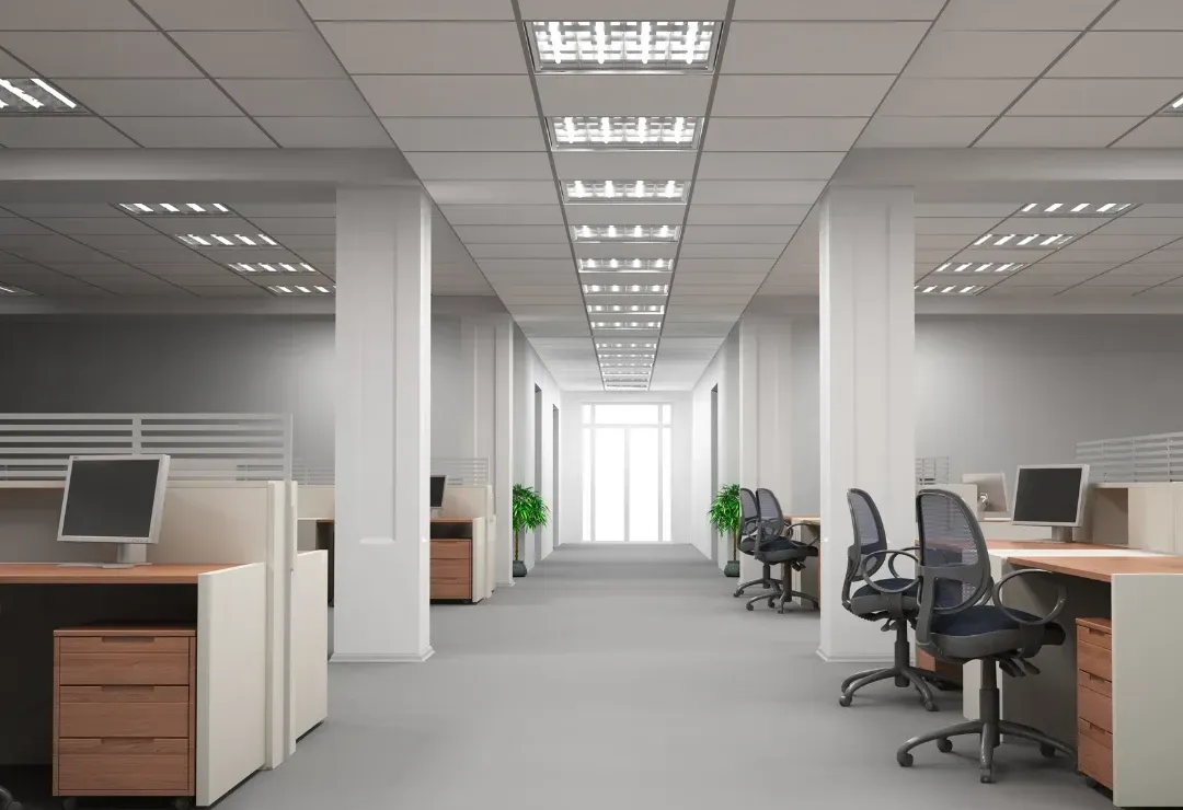 A hallway with glass walls and offices inside.
