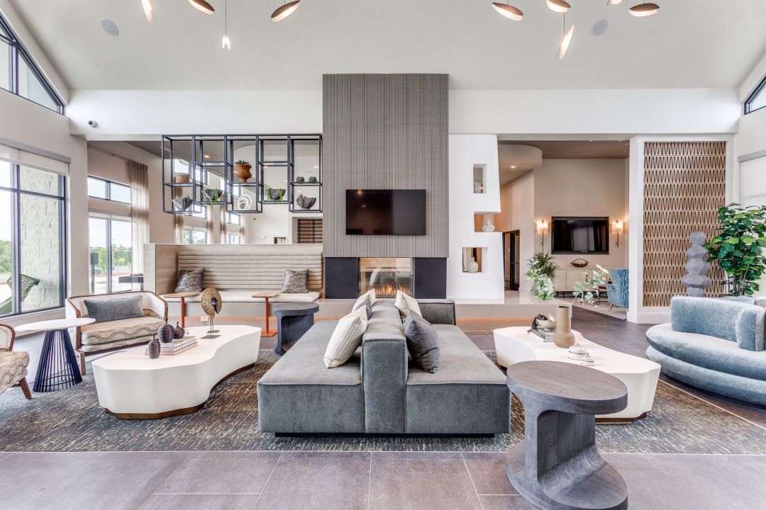 A living room filled with furniture and a fireplace.