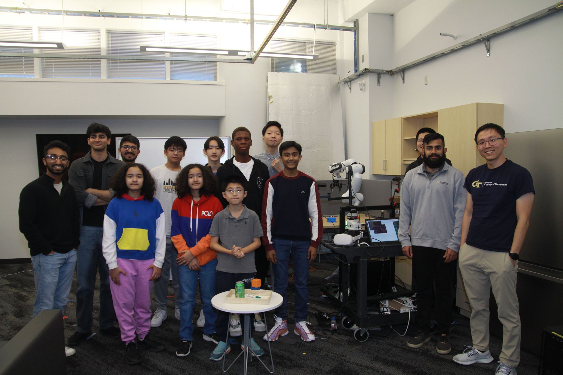 A group of people are posing for a picture in a room.