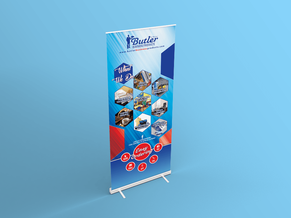 Roll-up banner with blue and red geometric designs and images of construction equipment, promoting Butler Construction.