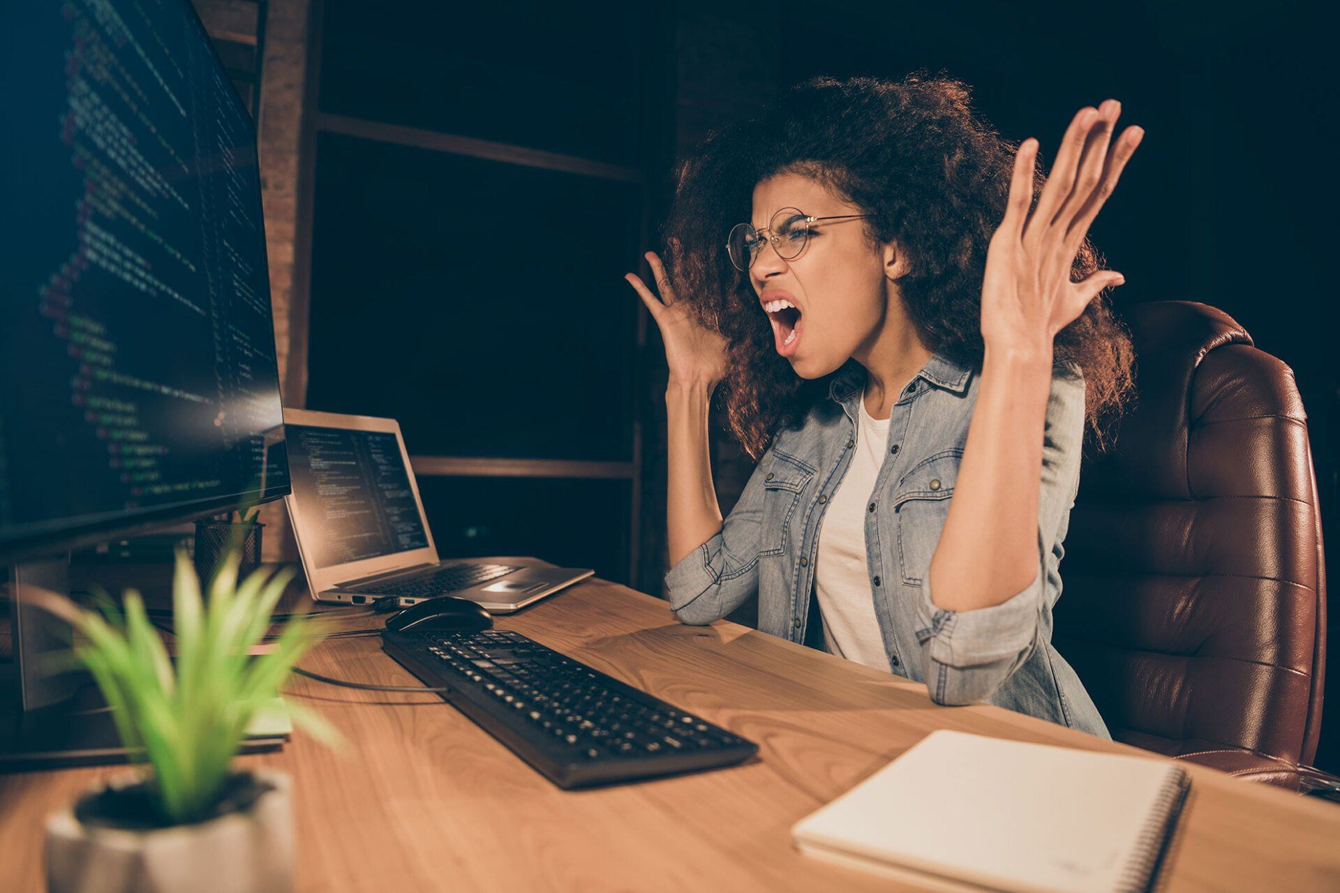 Black woman screaming at computer because of website design