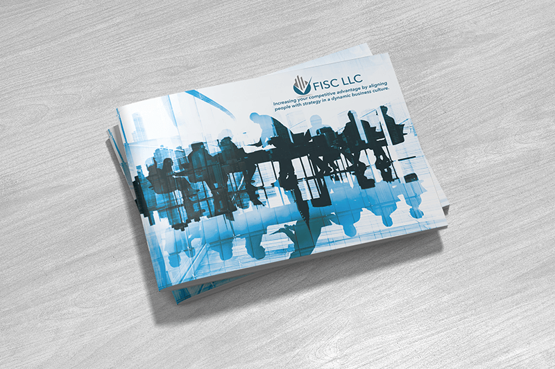 Stack of brochures with a blue abstract design on a gray wooden surface.