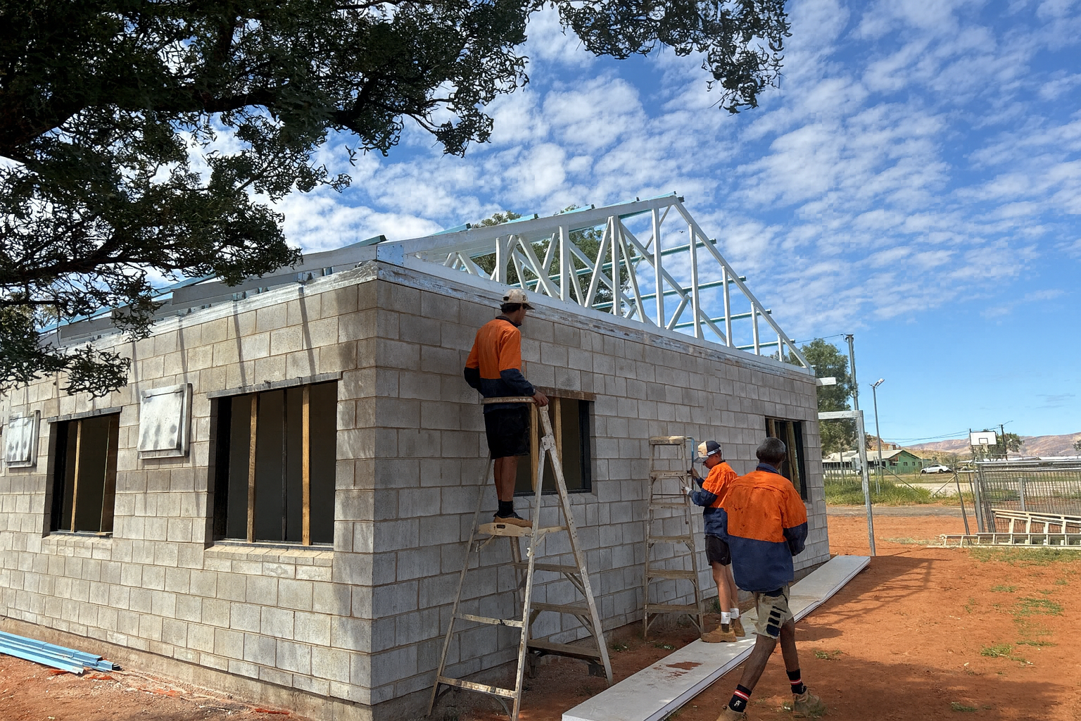 A House With a Sliding Gate in Front of It — Pedersen NT Pty Ltd in Ciccone, NT