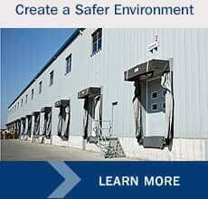 Loading docks of a warehouse with protective covers, blue sky, and