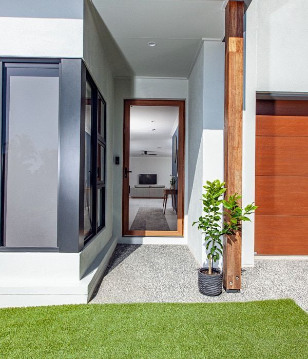 A House With A Potted Plant In Front Of It — Nambucca Glass In Nambucca Heads, NSW