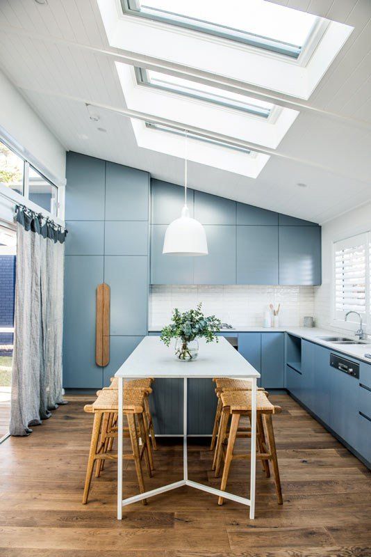 A Kitchen With Blue Cabinets And Skylights And Roof Window — Nambucca Glass in Nambucca Heads, NSW