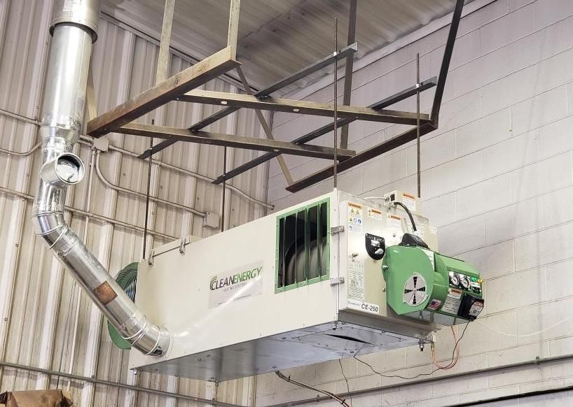 A machine is hanging from the ceiling of a building.