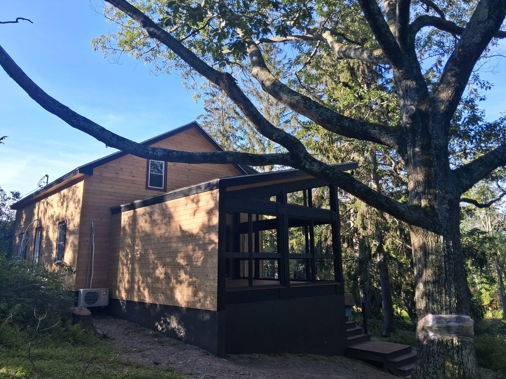 Wooden floor in a narrow hallway leading to a room