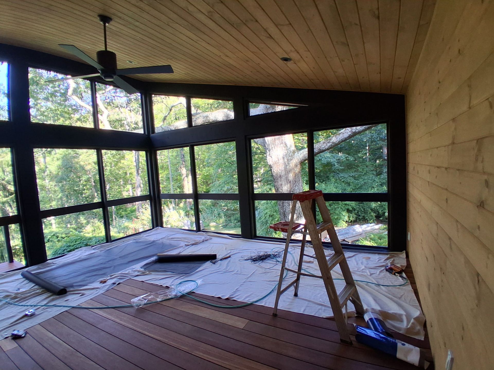 A partially constructed deck on backyard