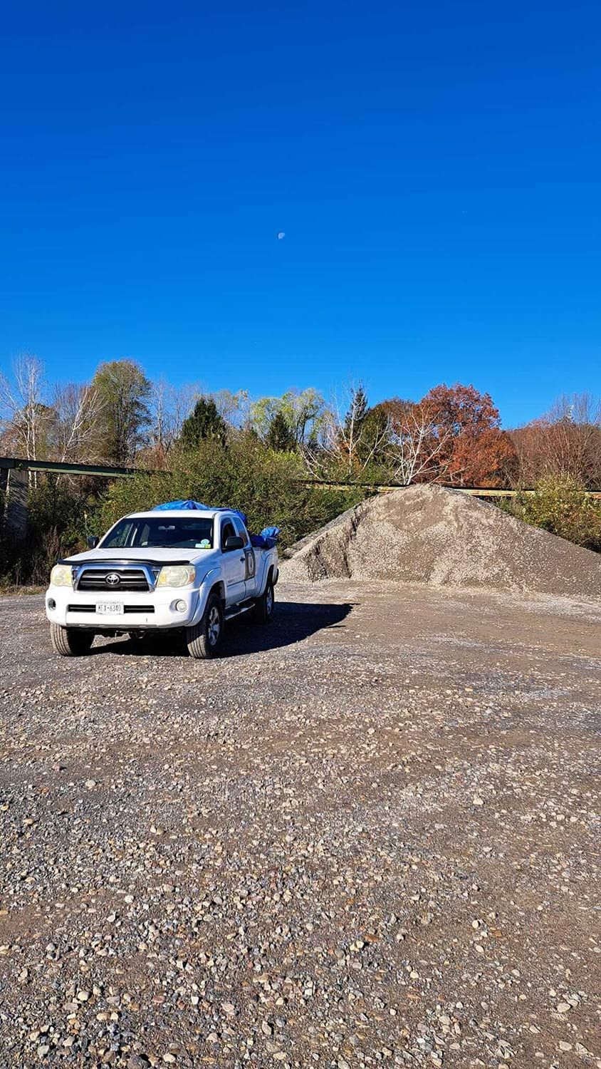 White pickup truck on gravel