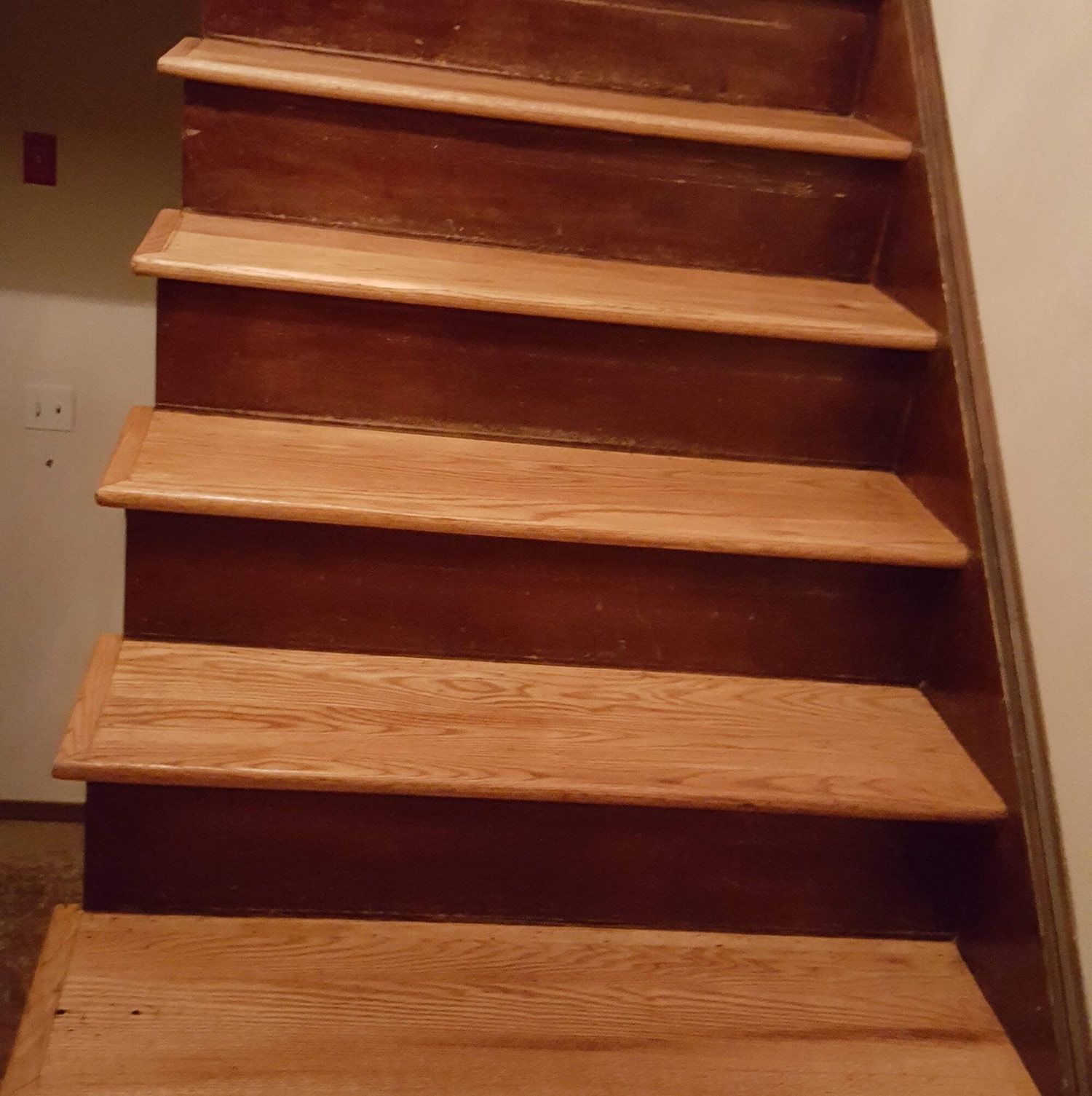 Wooden staircase with dark brown steps