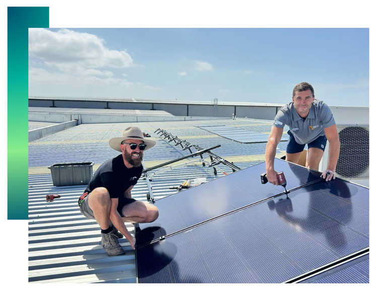 A roof with solar panels on it overlooking the ocean.