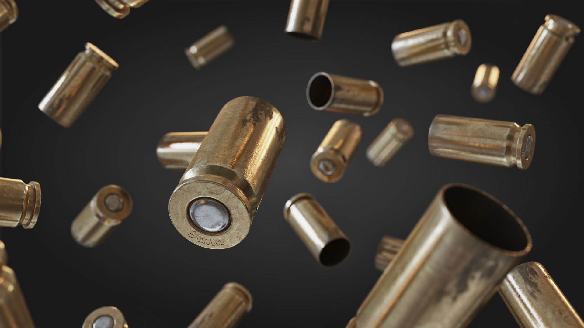 Brass bullet casings scattered against a dark gray background.