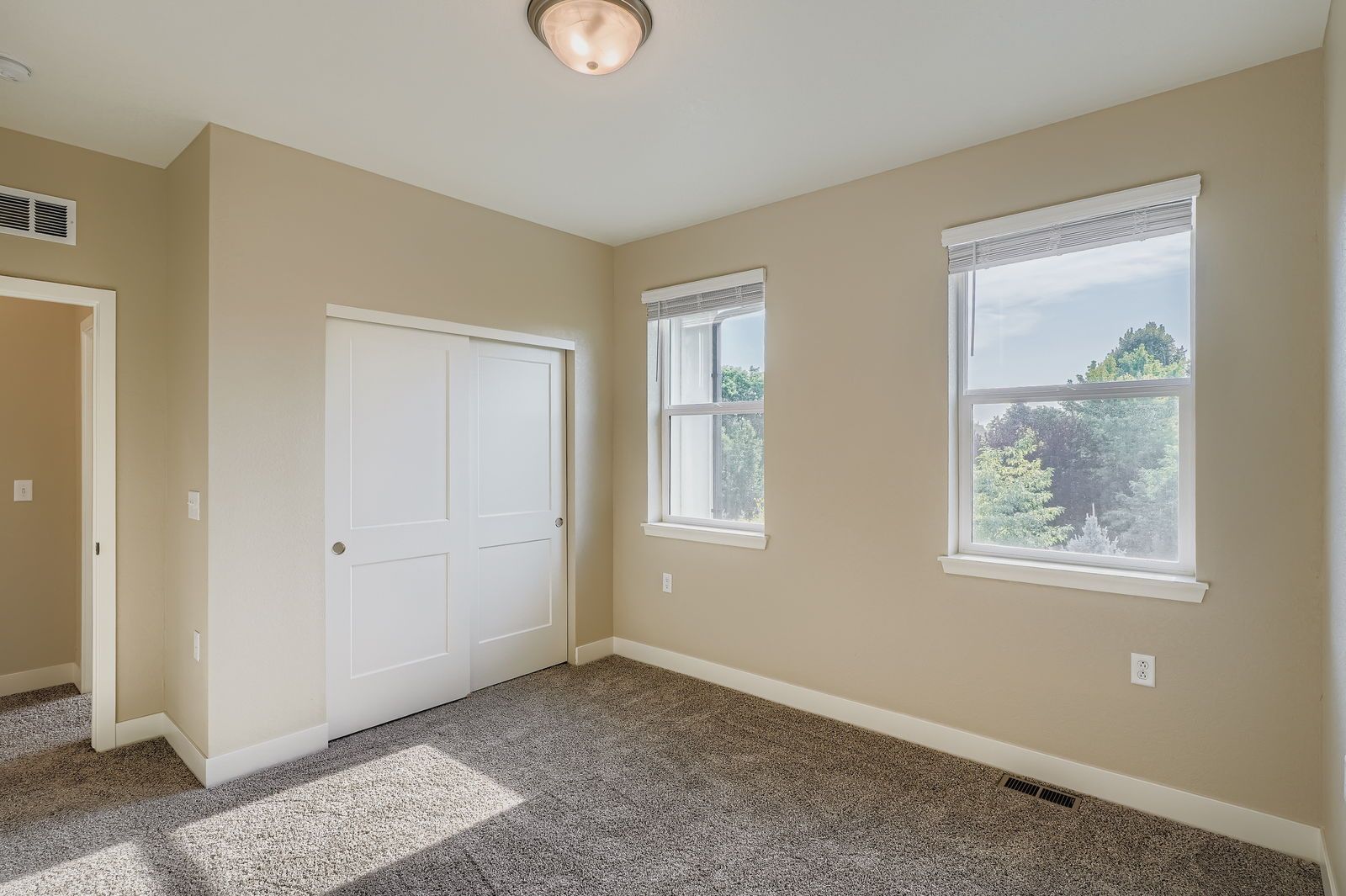 Two-story townhome bedroom with closet