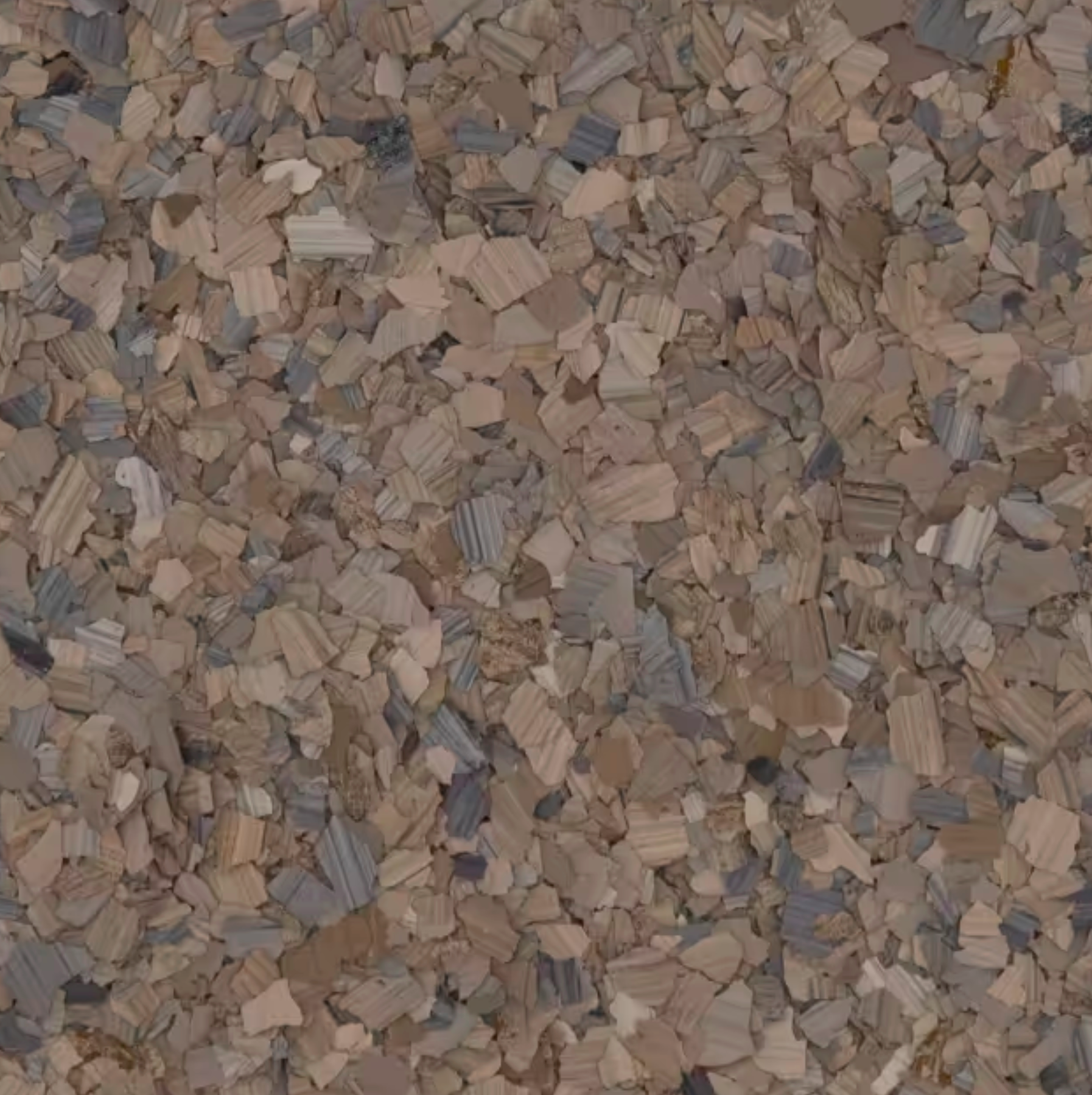 Un gros plan d'un tas de gravier gris.