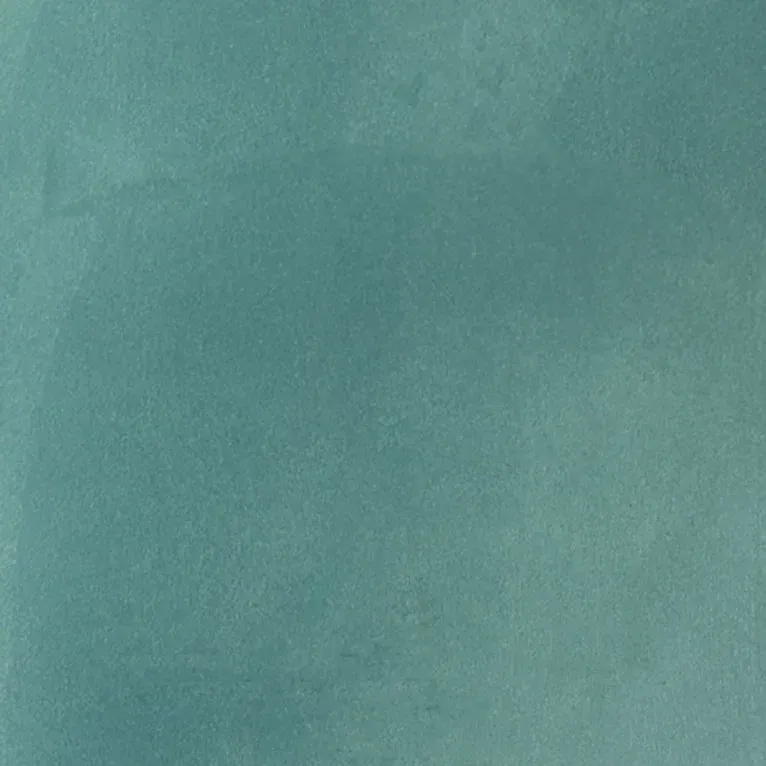 Un gros plan d'une texture de tissu en velours vert.