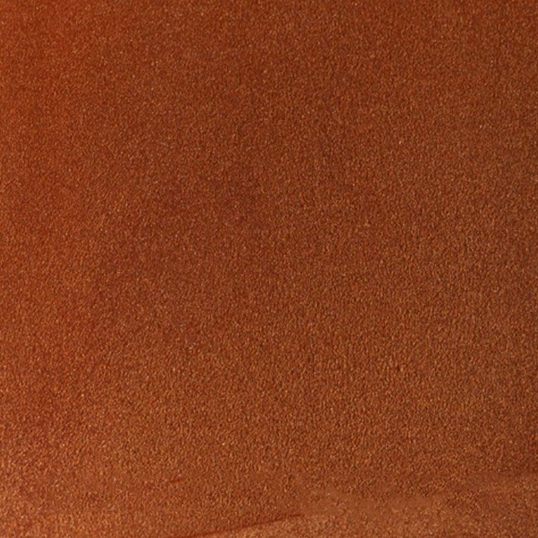 Un gros plan d'une texture de tapis marron.