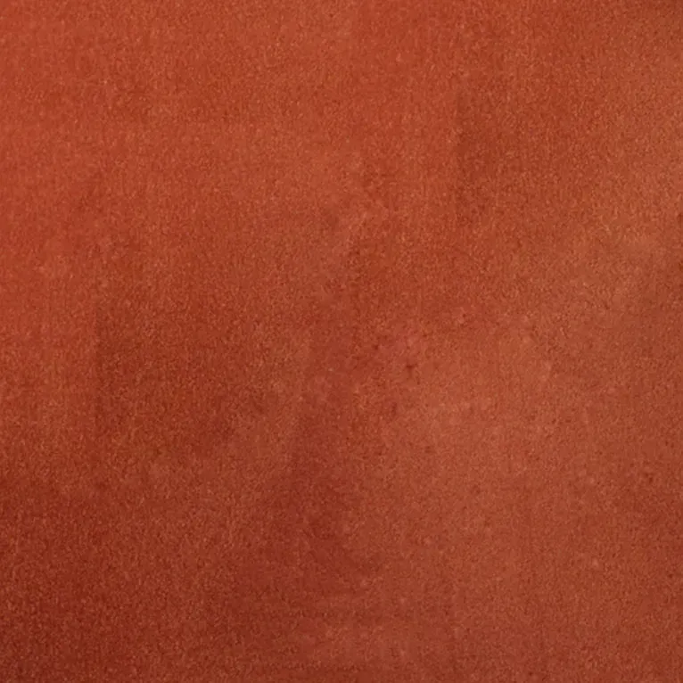 Un gros plan d'une texture de tuile rouge.