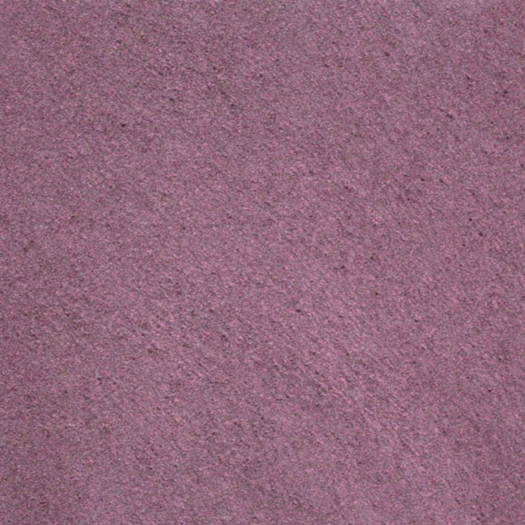 Un gros plan d'une texture de tapis violet.