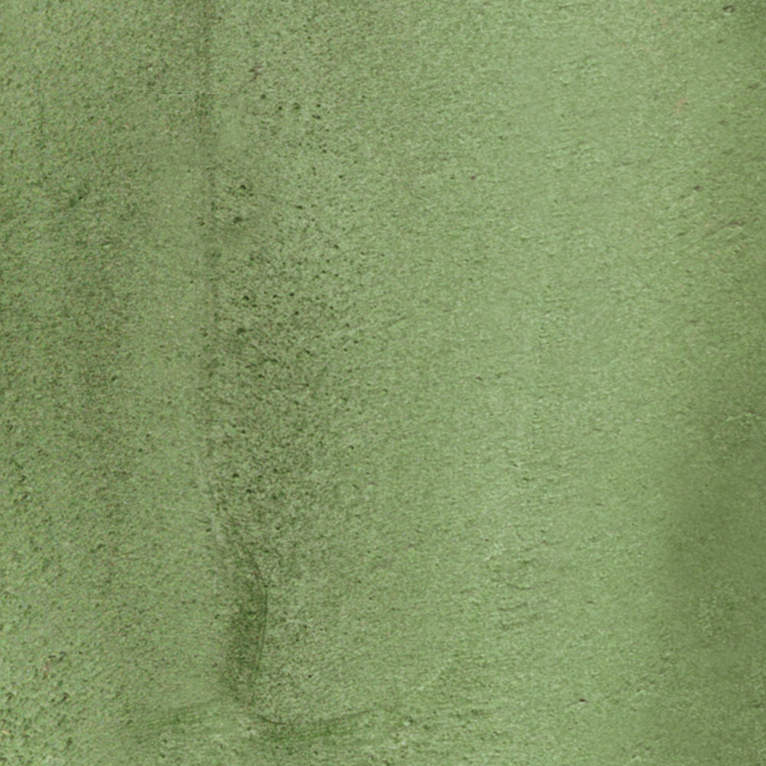 Un gros plan d'une texture de tapis vert.