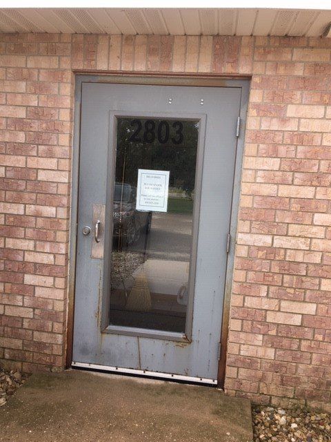 Door with Number on Brick Wall — Madison, WI — Patriot Glass LLC