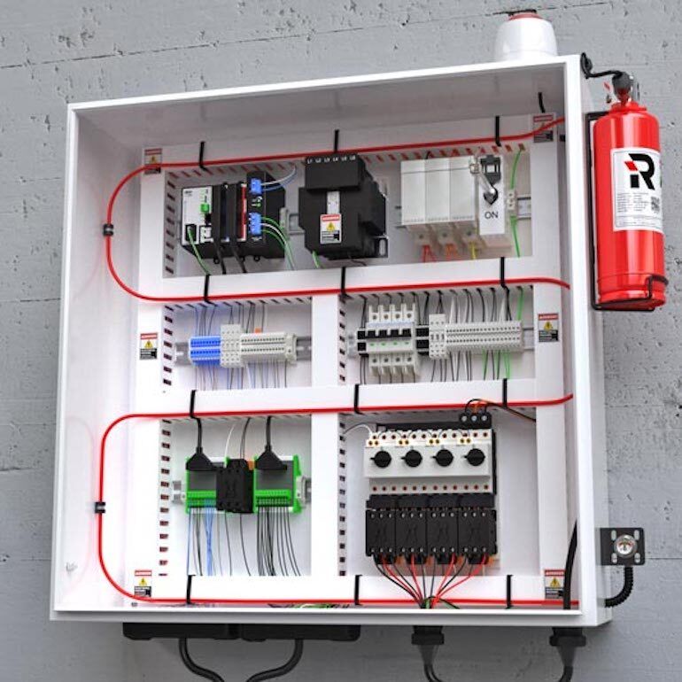 An open electrical cabinet with neatly organized wires, circuit breakers, and electronic components inside.