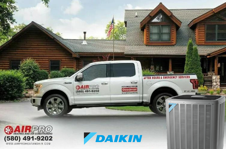 An AirPro truck is parked in front of a house with Daikin air conditioner