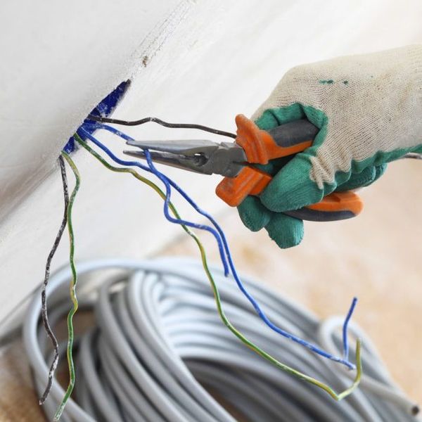 man fixing electrical wirings