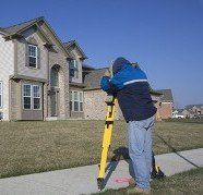 Surveying Near House - Land Surveying