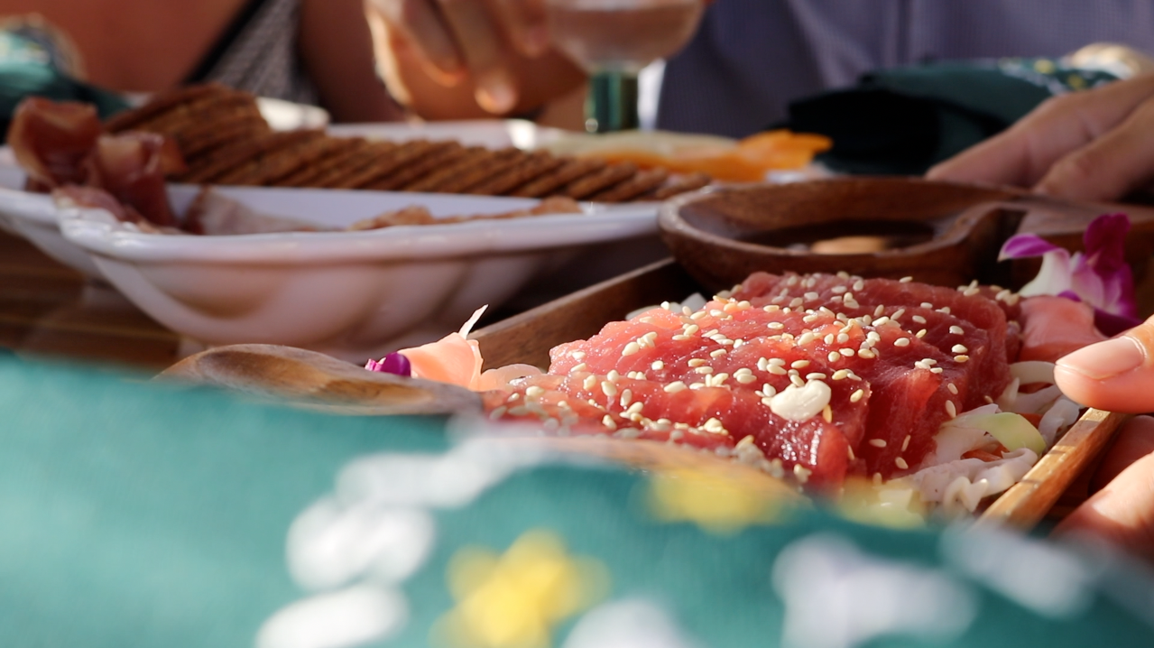 A close up of a person eating food at a table