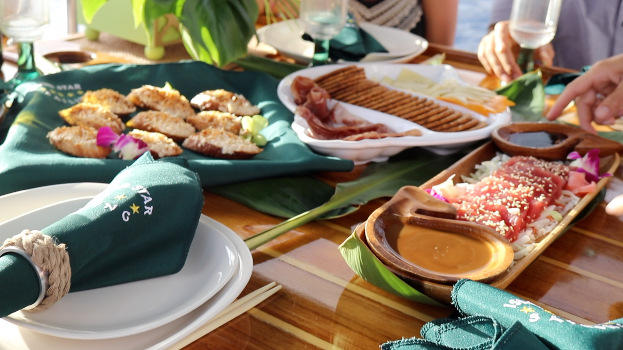 A wooden table topped with plates and plates of food.