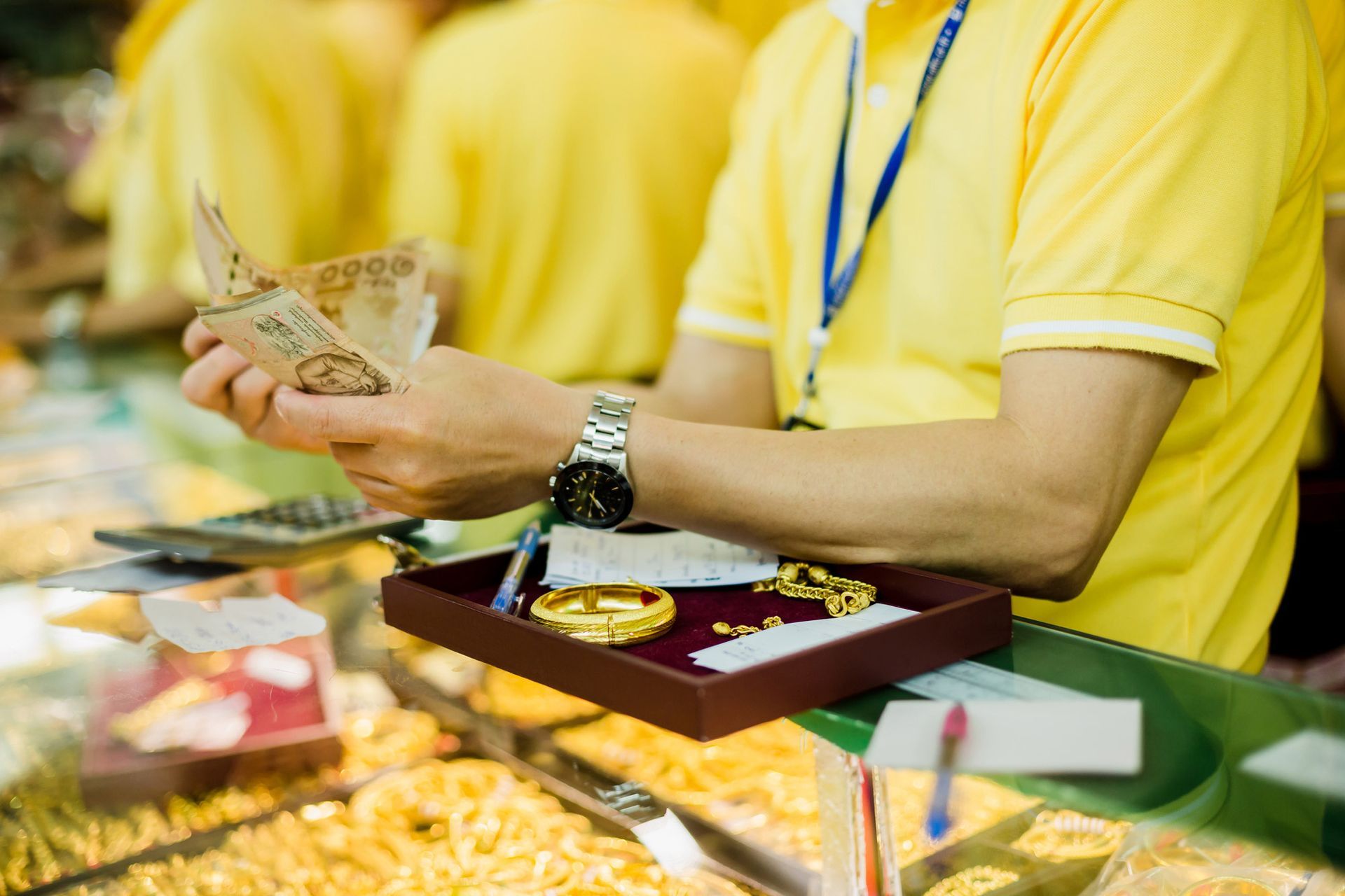 Persons working with yellow T-shirts | Collateral Loan Program in Pearl City HI