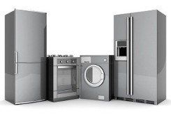 a refrigerator , washing machine , oven , and microwave are sitting next to each other on a white background .
