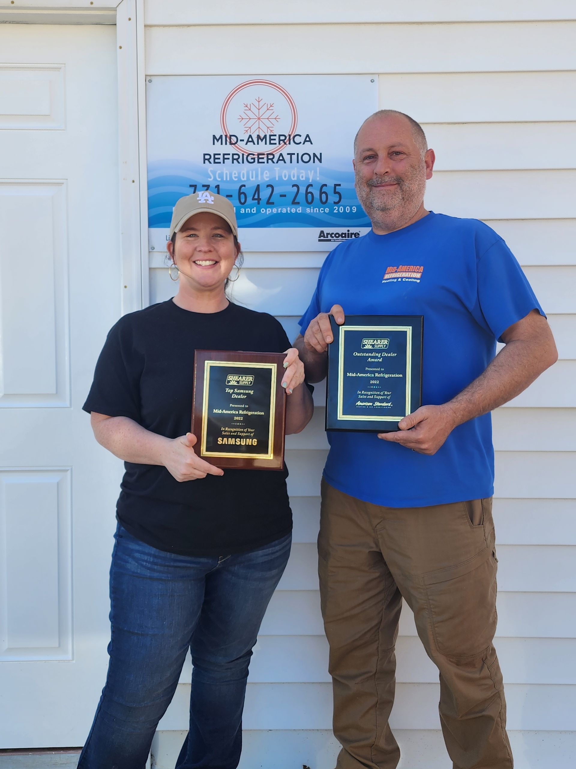 Couple Holding Awards — Paris, TN — Mid America Refrigeration
