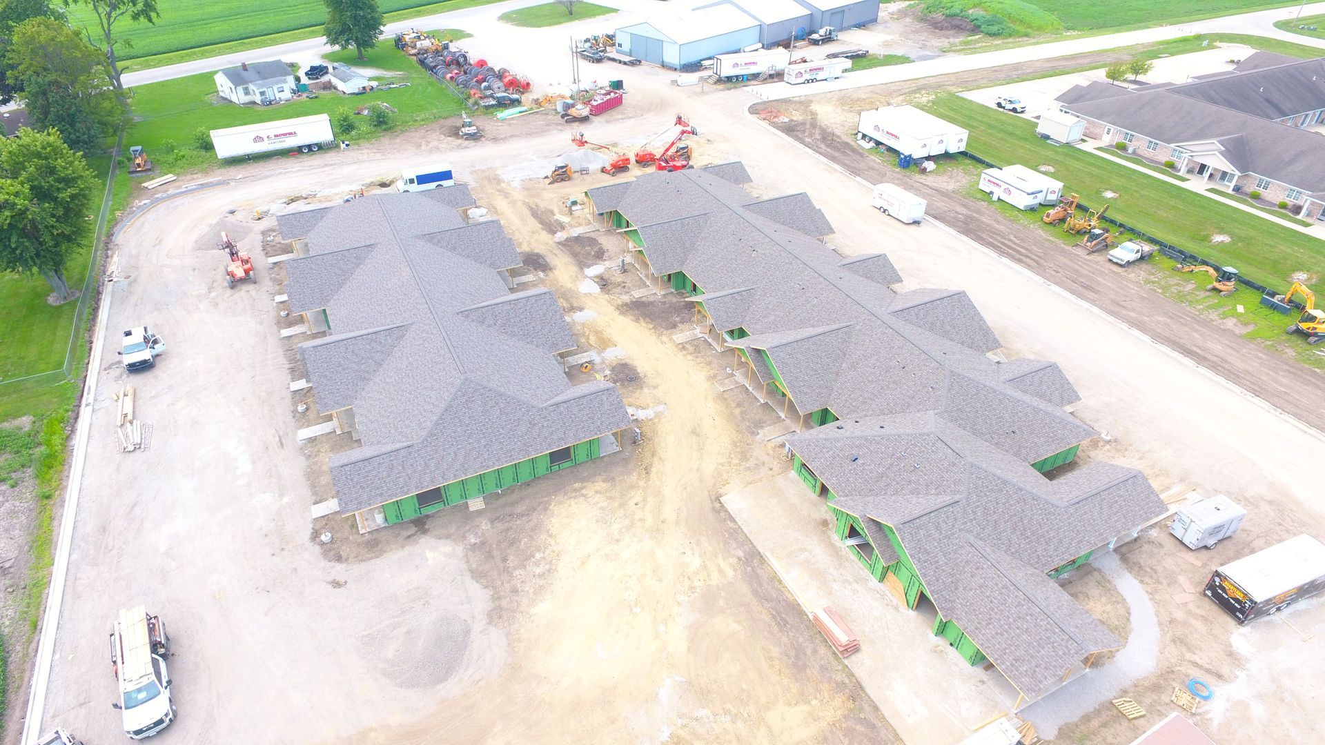 An aerial view of a row of houses under construction.