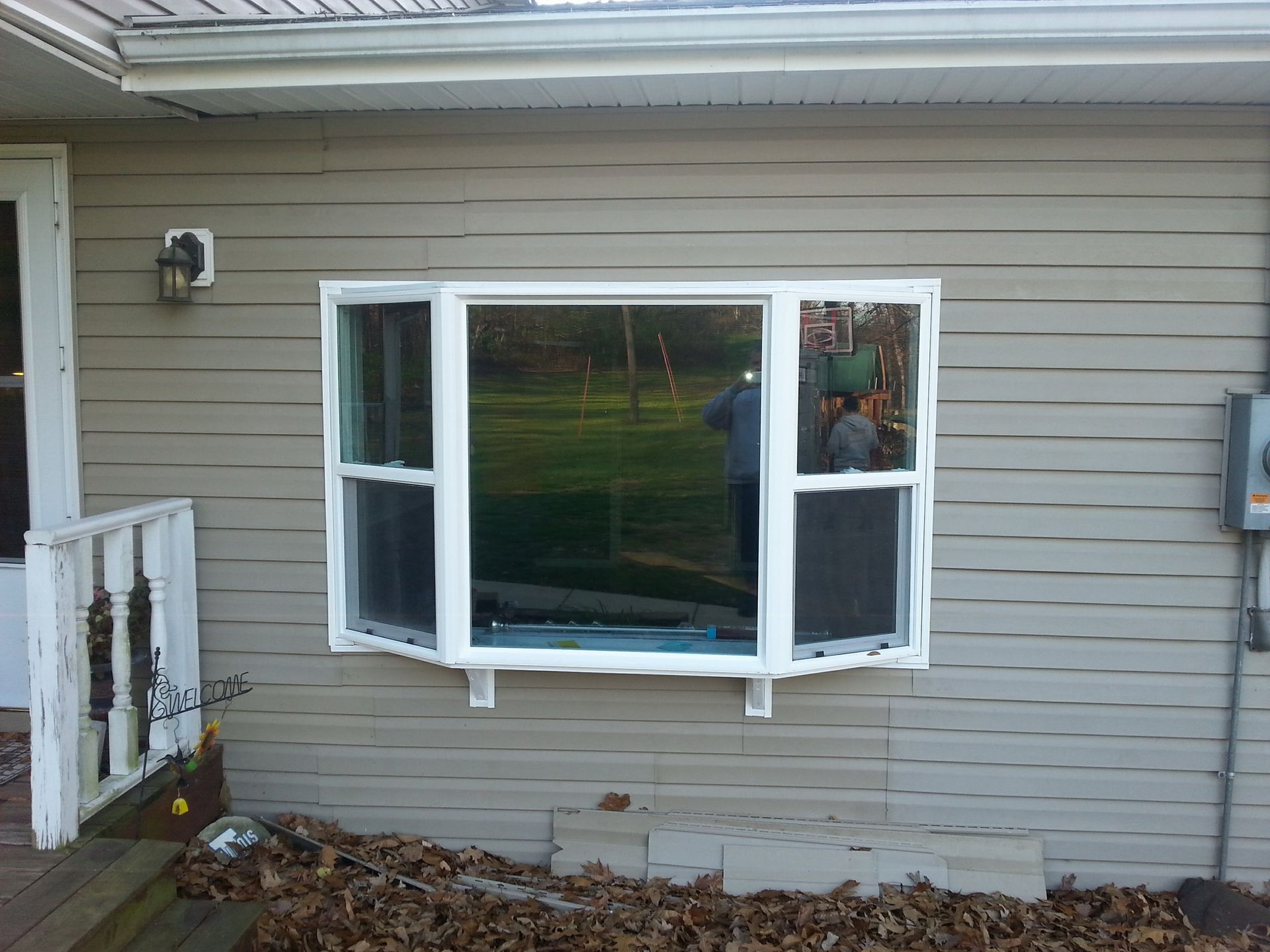 A house with a large window on the side of it