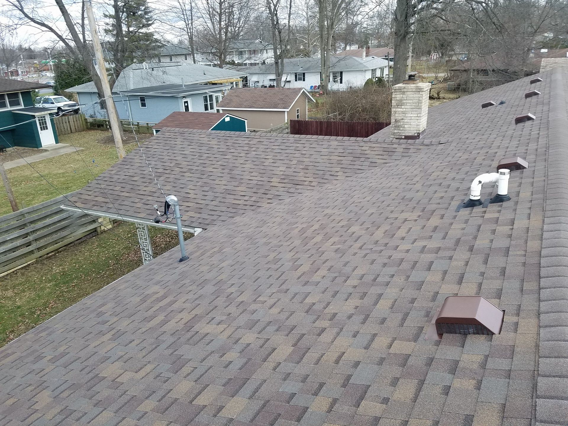 An aerial view of a roof with a chimney on it.
