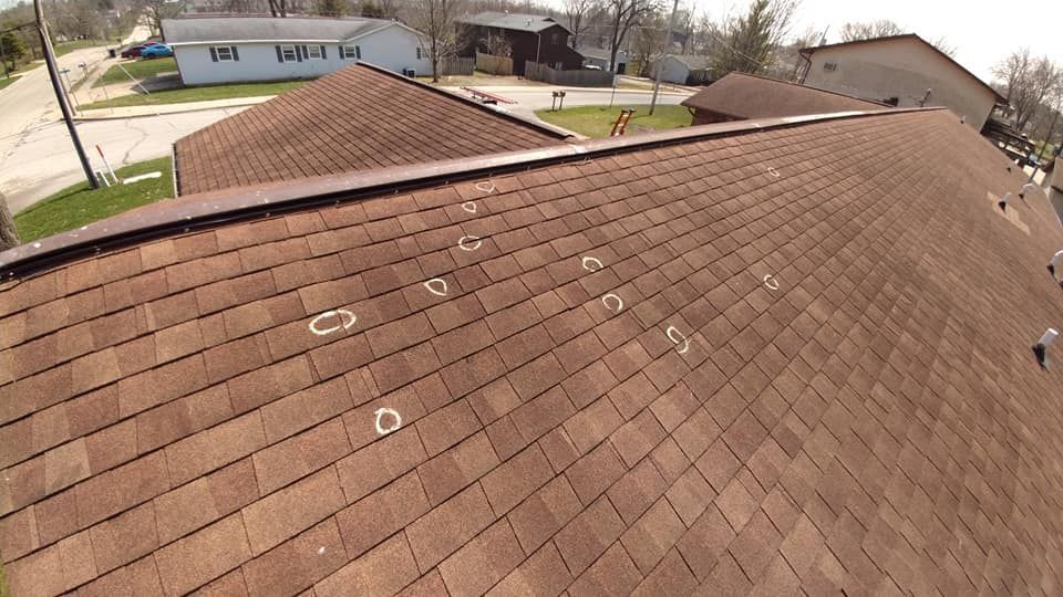 A roof with a lot of shingles and letters on it