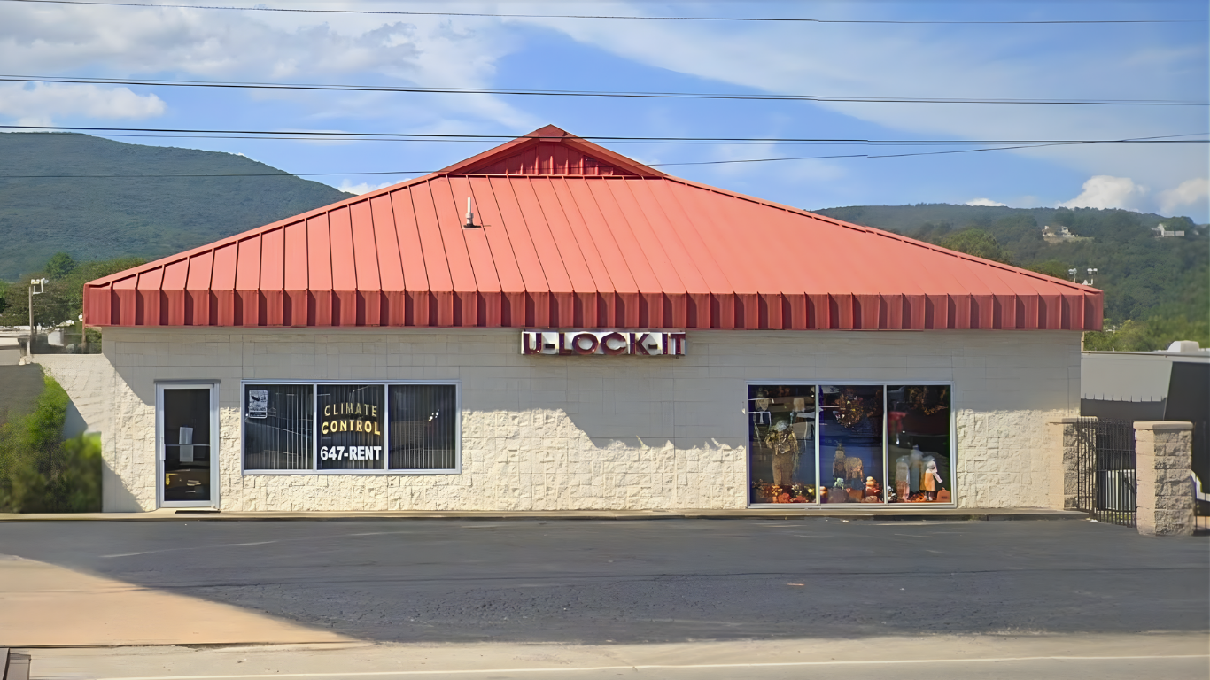 Storefront with a red roof; building reads 