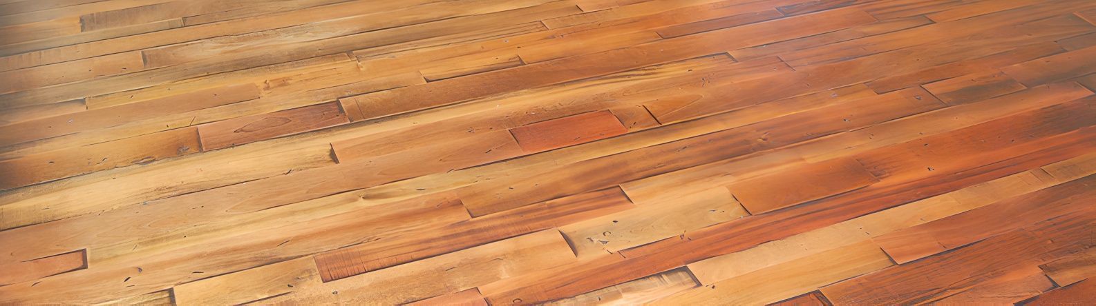 Wooden floorboards in shades of brown and tan, angled diagonally.