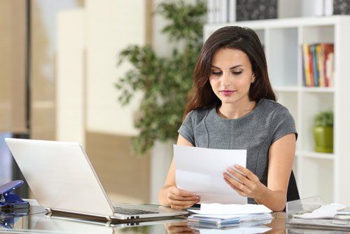 Businesswoman reviewing documents