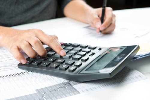  A man using a calculator