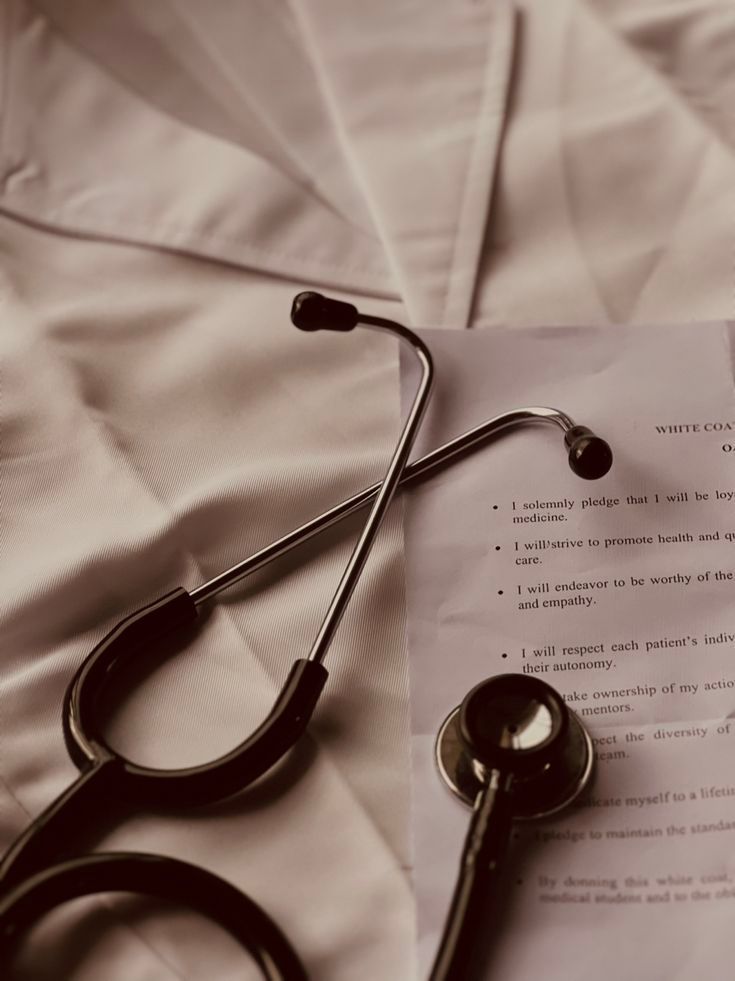 A stethoscope is laying on top of a piece of paper