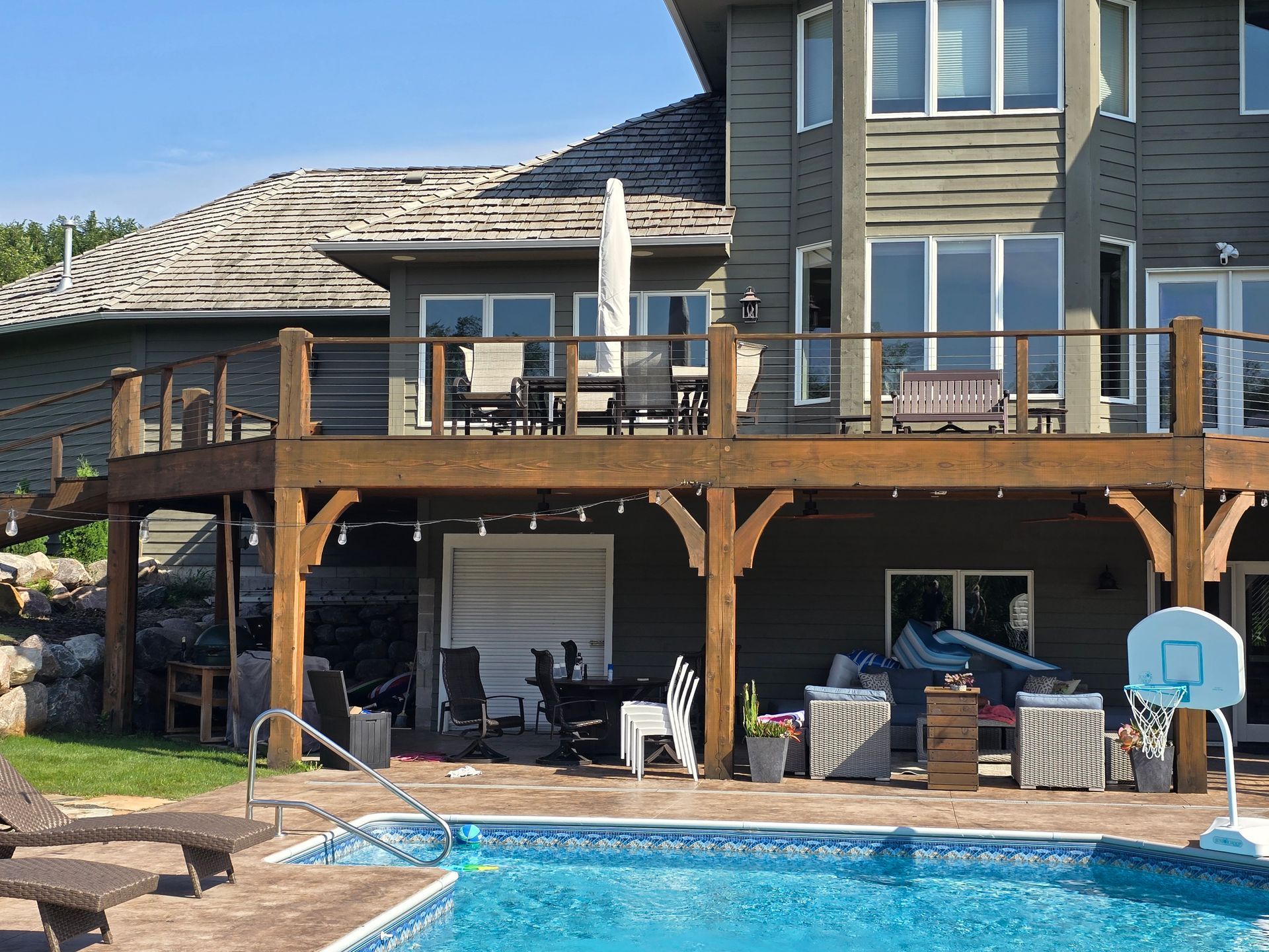 A large house with a large swimming pool in front of it
