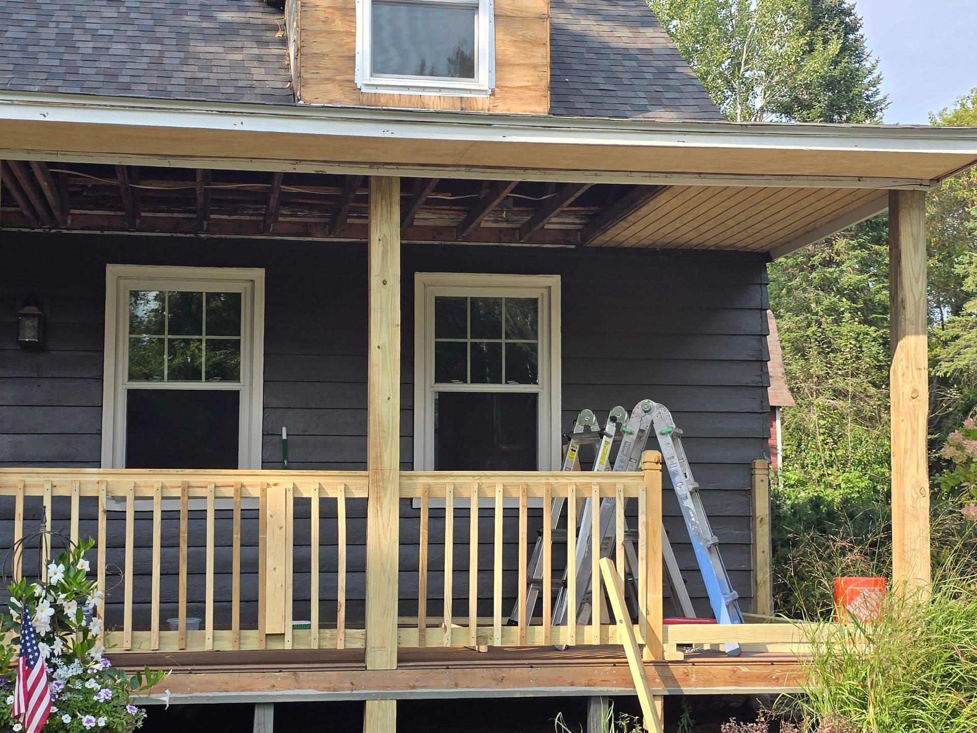 A house with a porch and a ladder on it