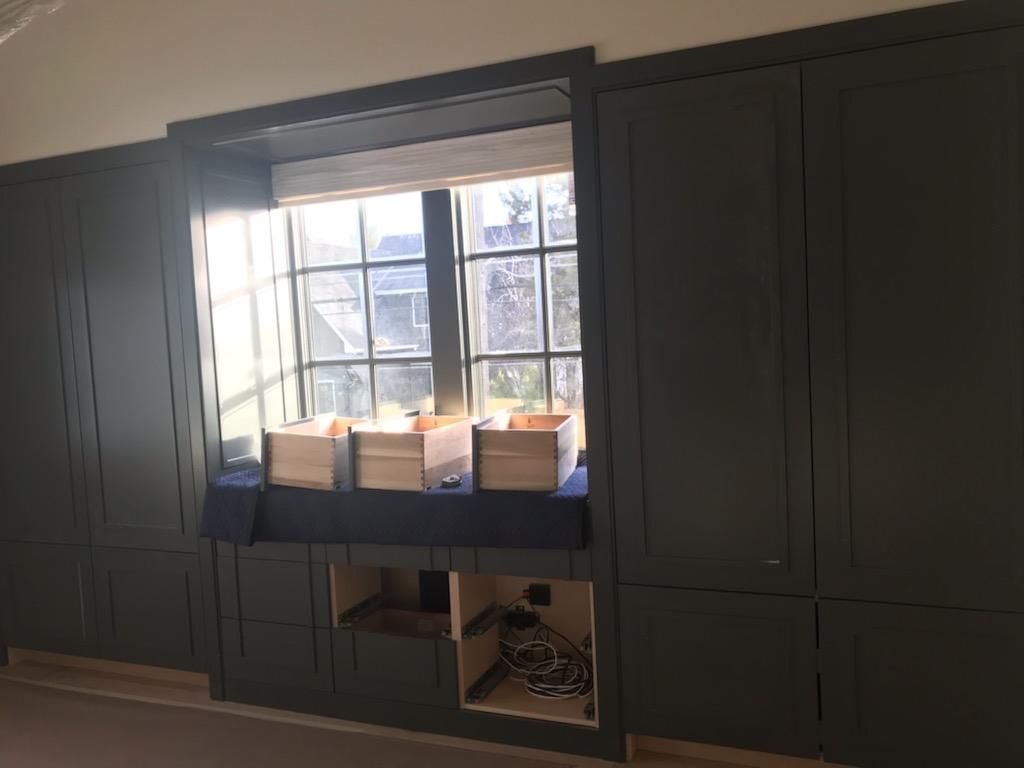 A room with a window and boxes in it.